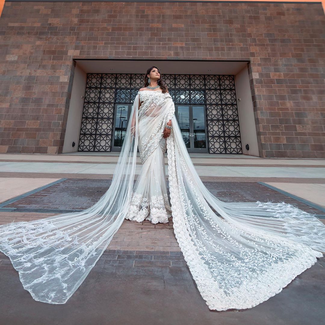 PEARL WHITE COLOR SAREE WITH FAIRY LONG TRAIL