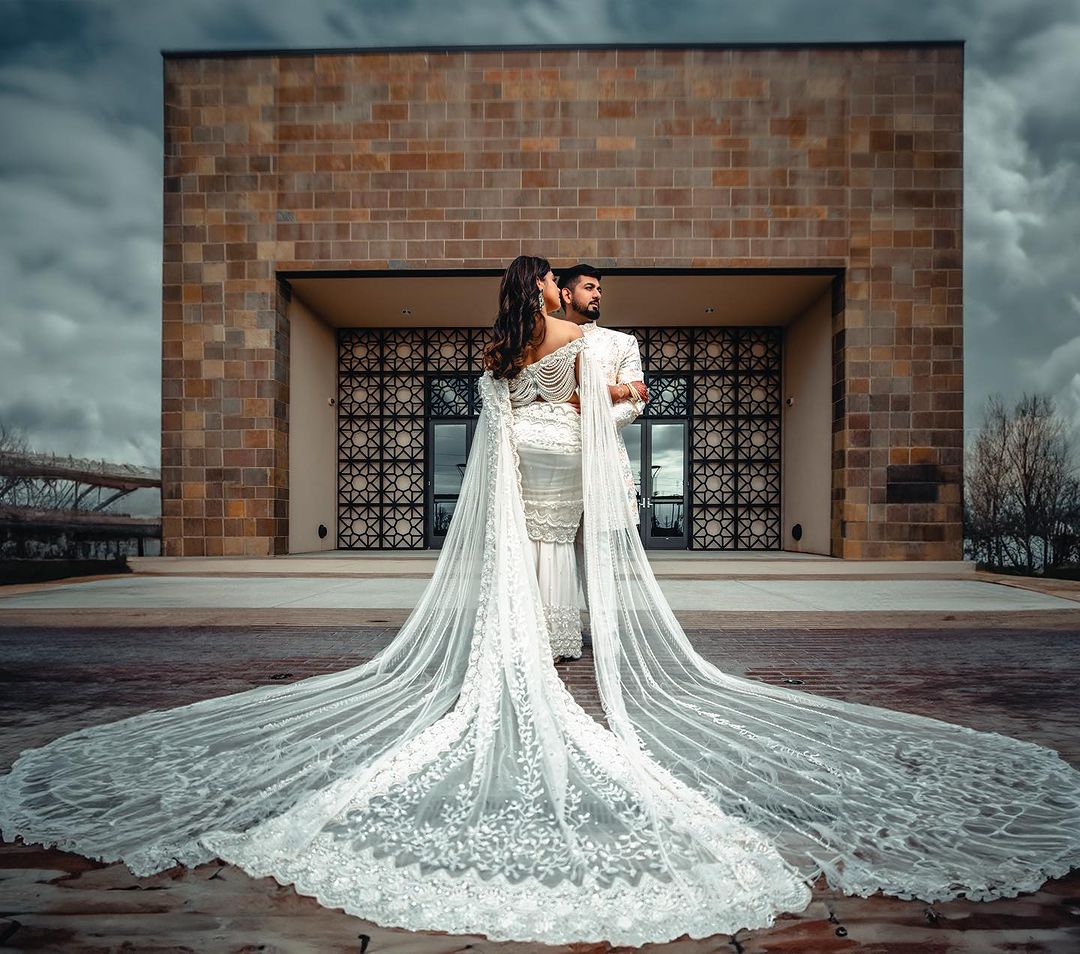 PEARL WHITE COLOR SAREE WITH FAIRY LONG TRAIL