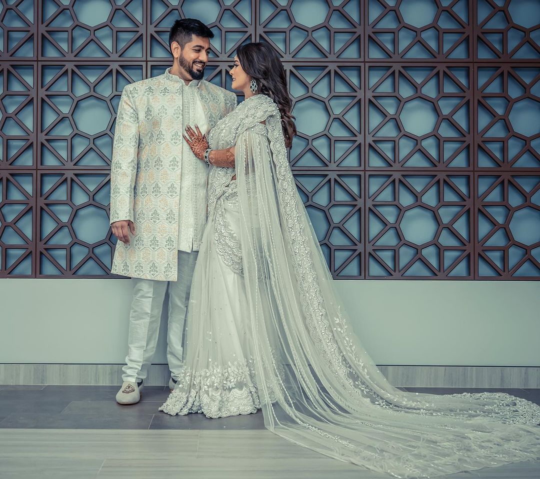 PEARL WHITE COLOR SAREE WITH FAIRY LONG TRAIL