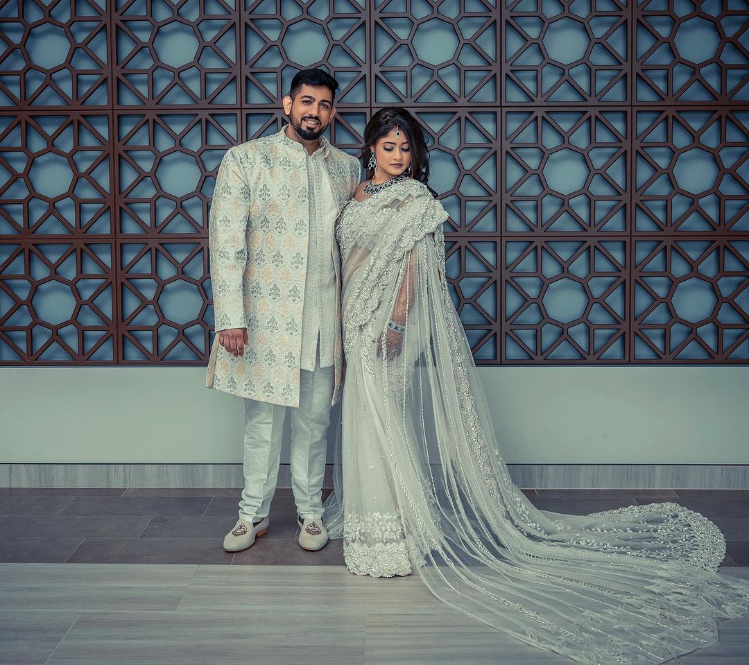 PEARL WHITE COLOR SAREE WITH FAIRY LONG TRAIL