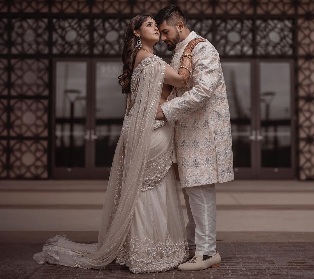 PEARL WHITE COLOR SAREE WITH FAIRY LONG TRAIL