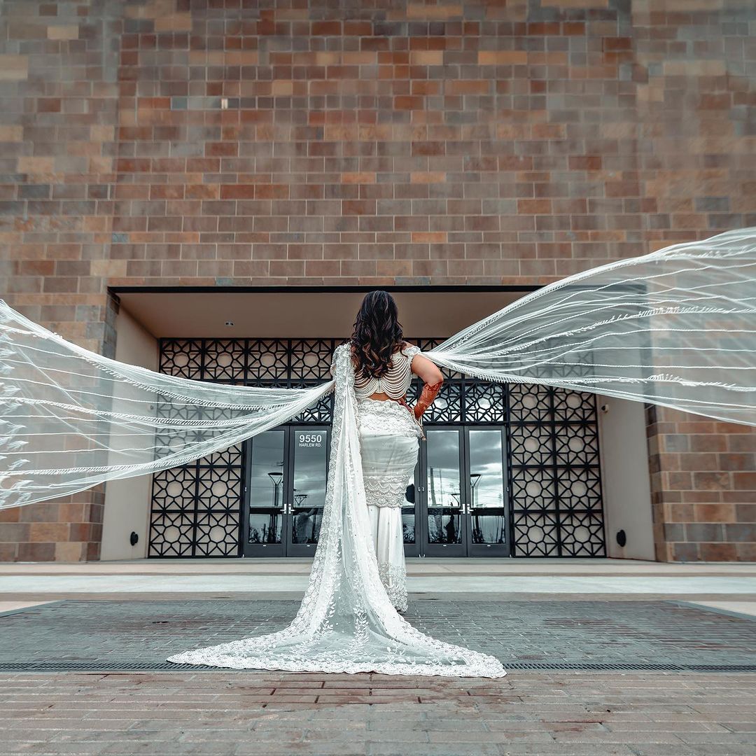 PEARL WHITE COLOR SAREE WITH FAIRY LONG TRAIL
