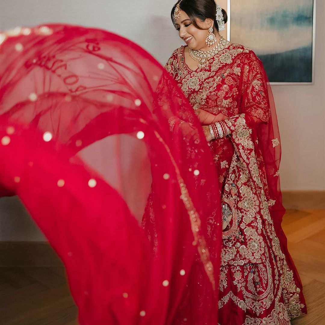 CARDINAL RED BRIDAL LEHENGA WITH GRACEFUL TRAIL