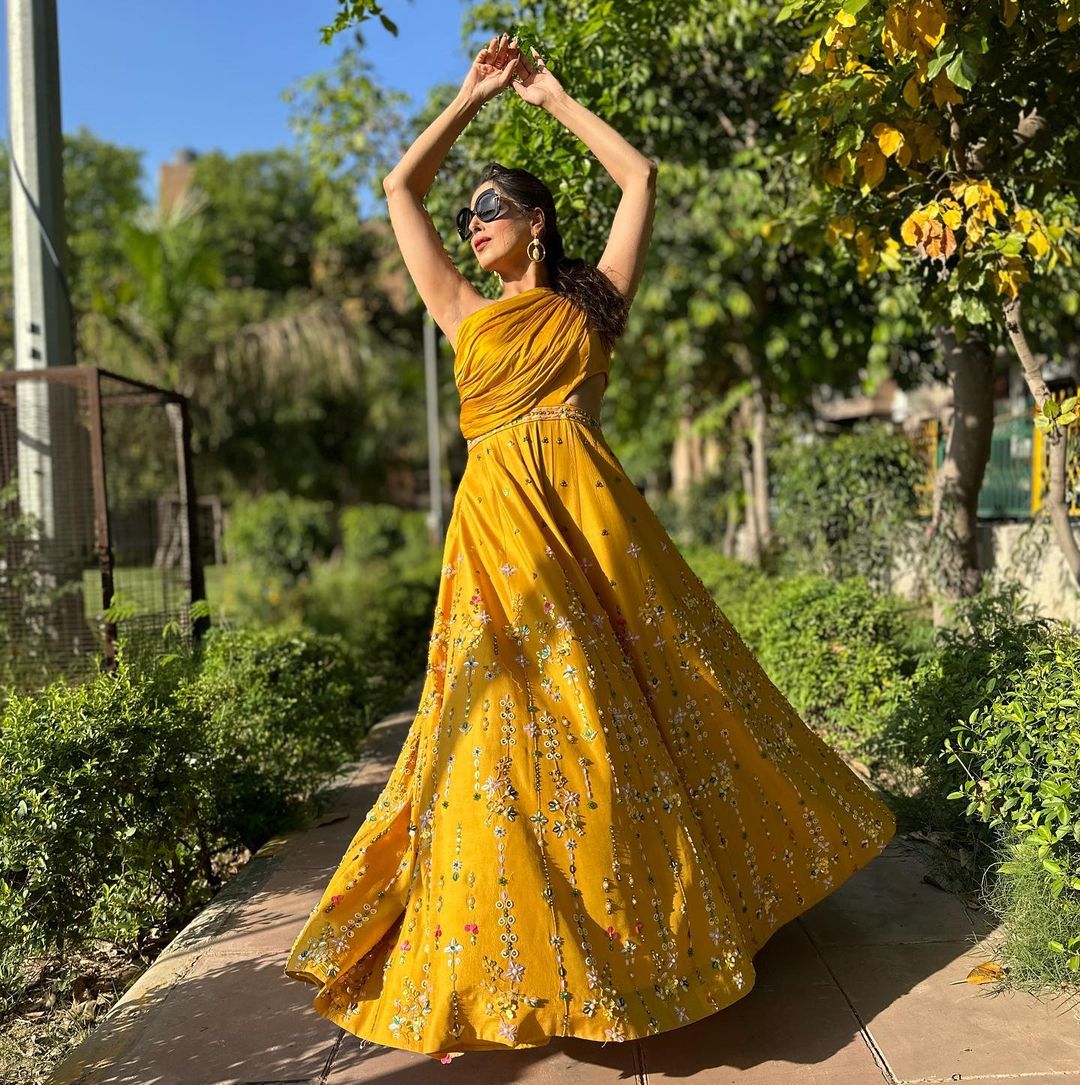 YELLOW COLOR KURTI WITH EMBROIDERY ON BOTTOM