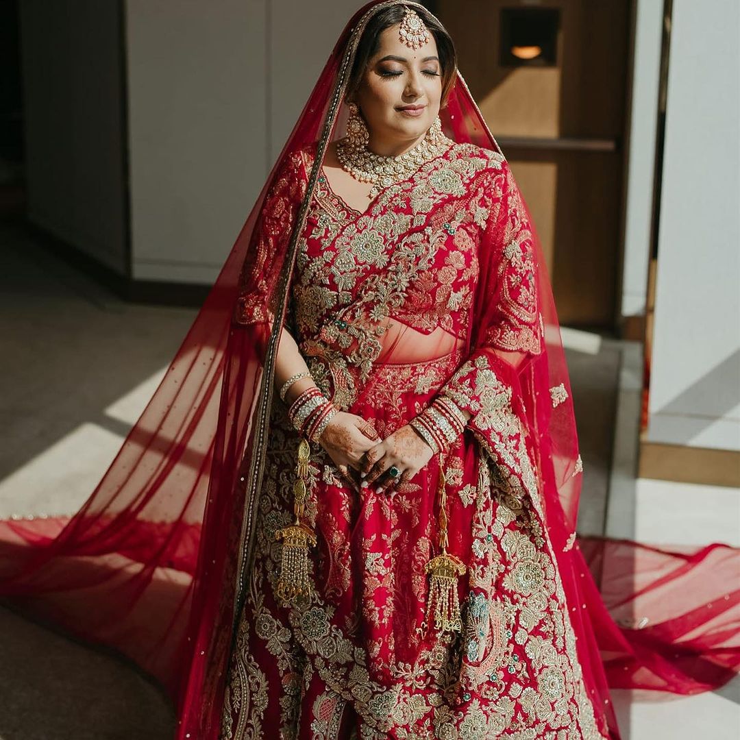 CARDINAL RED BRIDAL LEHENGA WITH GRACEFUL TRAIL