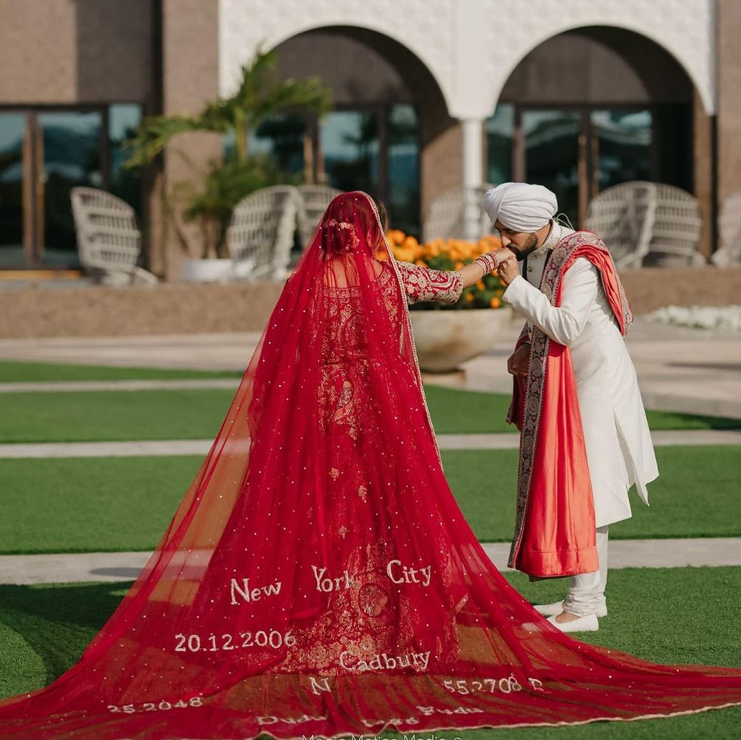 CARDINAL RED BRIDAL LEHENGA WITH GRACEFUL TRAIL