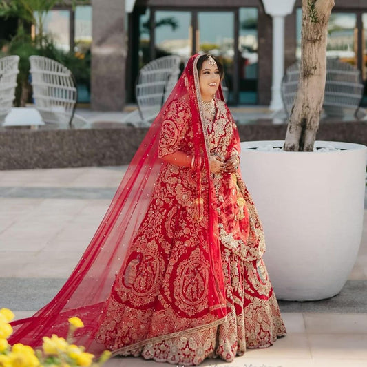 CARDINAL RED BRIDAL LEHENGA WITH GRACEFUL TRAIL